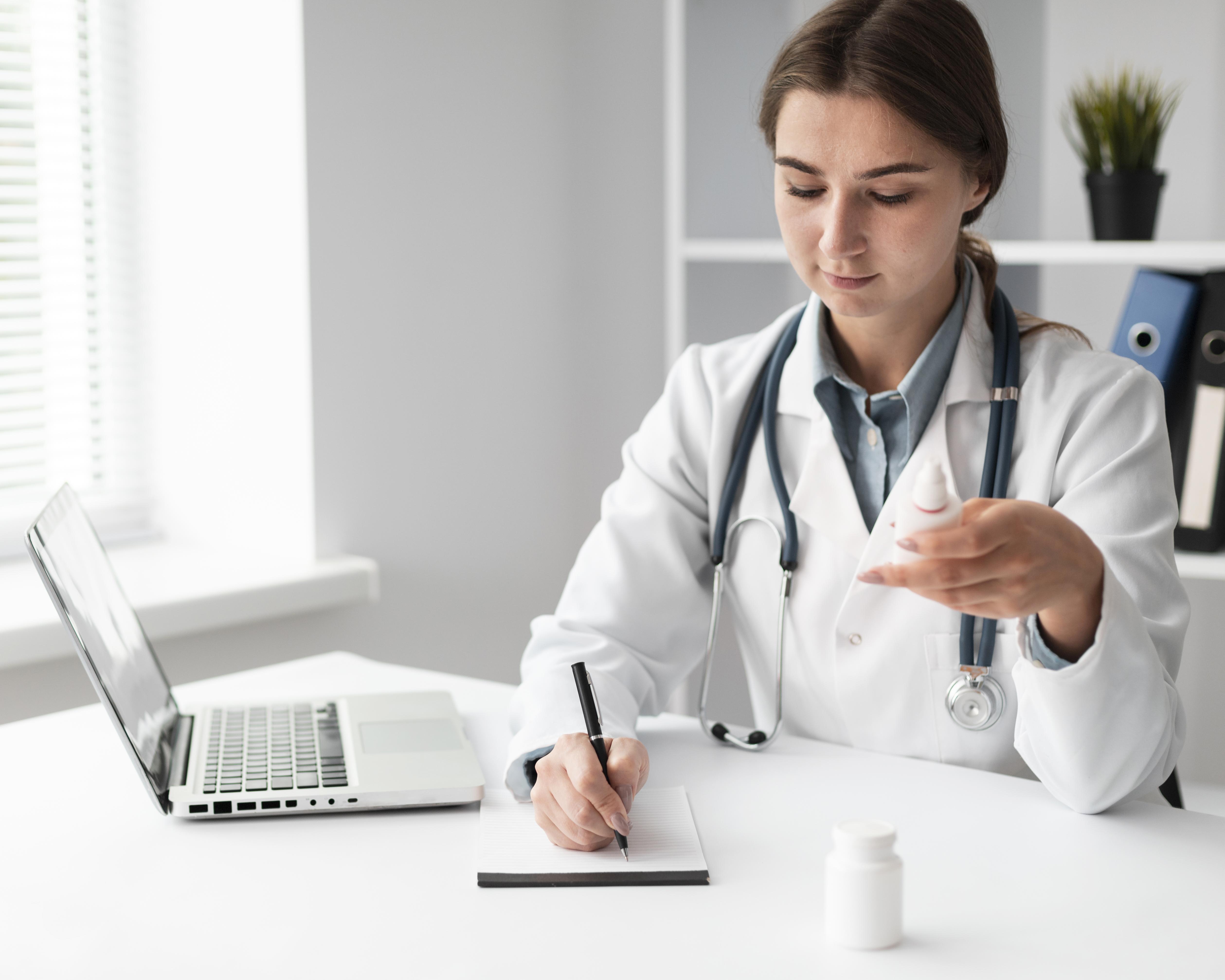 AAPC-certified physician documenting clinical billing and care notes